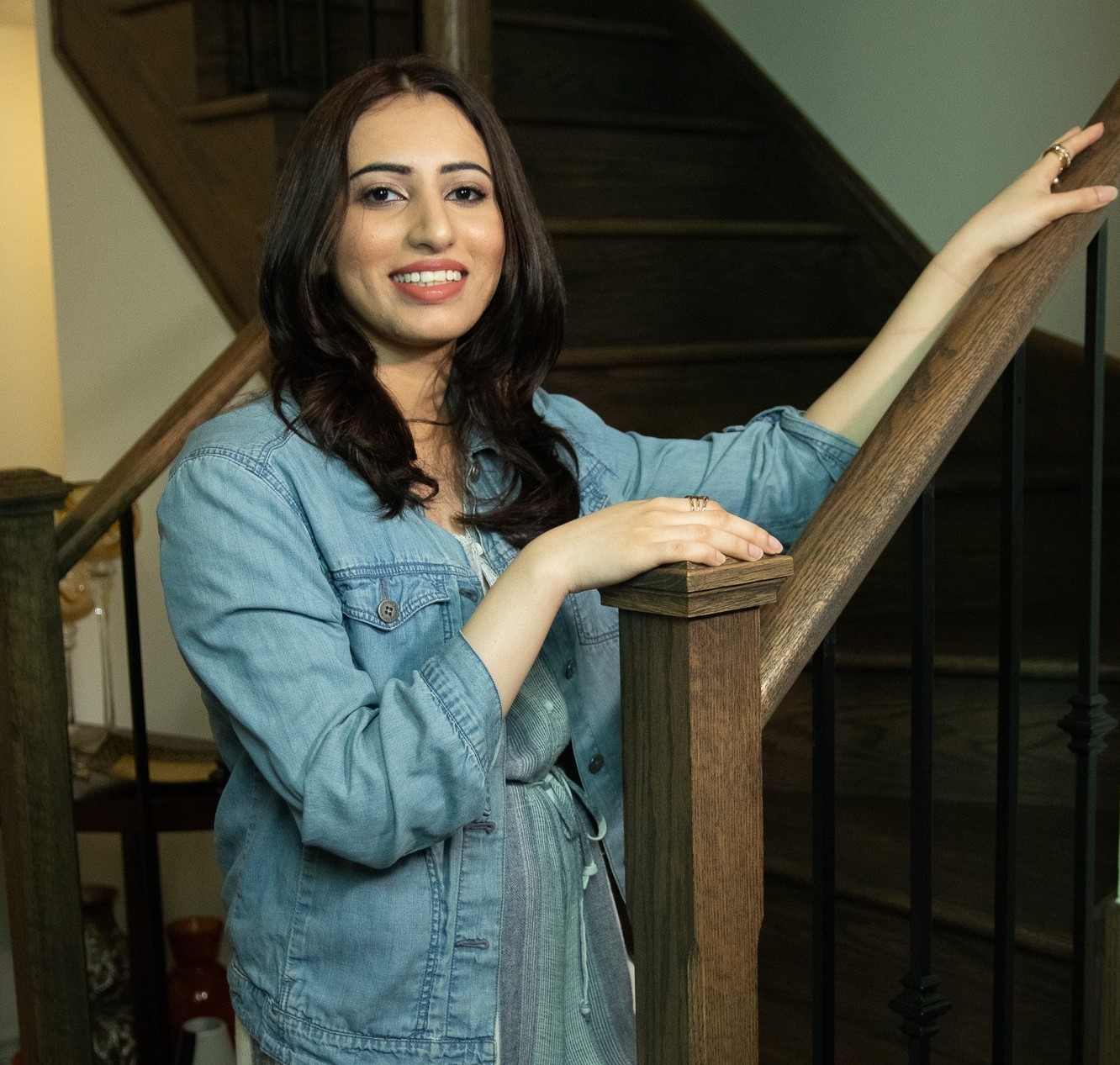 profile image of a girl on near the stairs smiling